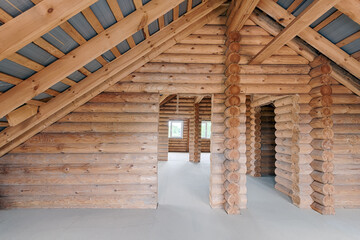 Log house interior under construction. Country house made of logs, interior without furniture