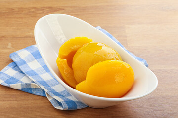 Sweet canned peaches with syrope