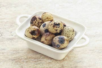 Raw quail eggs heap in the bowl