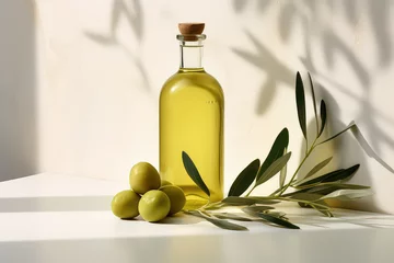 Rolgordijnen Commercial photography, glass bottle of olive oil with olive branch isolated on flat color wall background with copy space. © dinastya