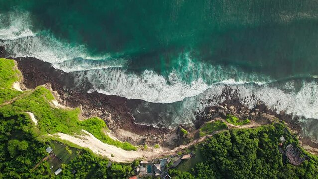 Huge oceanic waves crashing steep cliffs at Uluwatu, Bali, Indonesia.
DJI Mavic drone beautiful relaxing aerial footage 