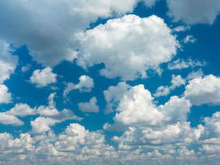 view to a lot of white clouds in blue sky for backgrounding