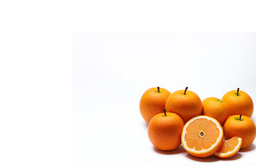 slices of citrus fruits - oranges with green leaves & copy space text