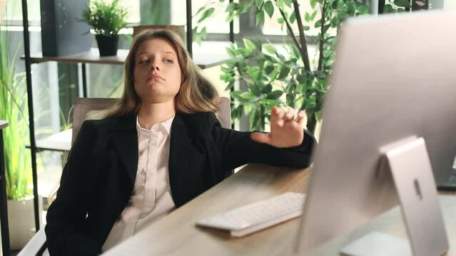 Tired exhausted young businesswoman typing on computer at office workplace Portrait of overworked employee office worker want to sleep on desktop indoors Stress work concept