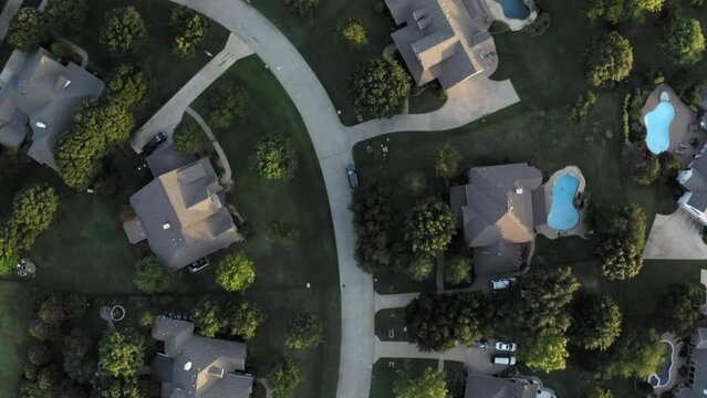 Straight down aerial in Parker Texas neighborhood following curve of street