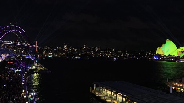 Vivid Sydney night time light show projection on city architecture landmark 4k.
