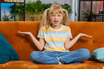 What. Why. Young child kid girl raising hands in indignant expression, asking reason of failure,...