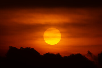 Sun on sunset sky and clouds background