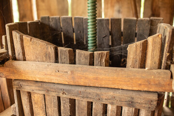 Old wooden grape press in the barn.Peasant tools.
