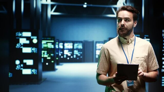 IT specialist in server room ensuring valuable data remains secure from potential threats, safeguarding against unauthorized access and vulnerabilities, securing system from DDoS attacks