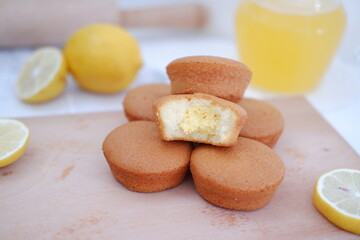 Lemon cake with lemon on wood background. Selective focus.