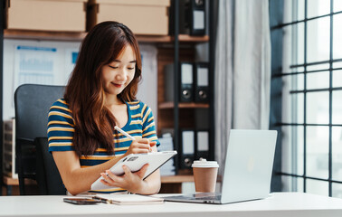 Excited Asian female student doing Online MBA and Business Degree Programs and learn indian...