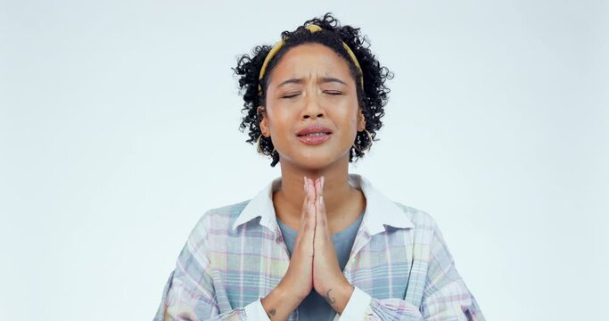 Hands, hope and nervous woman praying in studio for wish, good luck or spiritual help on white background. Pray, emoji and female model with prayer for results, news or waiting for feedback or review