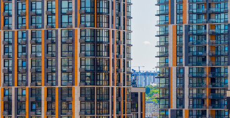 Fototapeta premium a fragment of a modern high-rise building with windows for the banner background