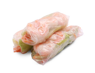 Tasty spring rolls with shrimps, carrot and lettuce on white background