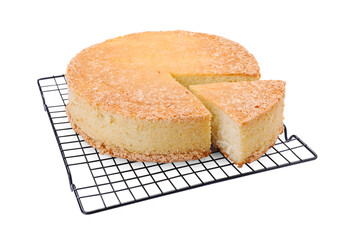 Baking rack with tasty sponge cake isolated on white