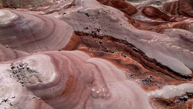 Aerial-Top Down-Brightly colored bands of bentonite clay create beautiful patterns in the Bentonite Hills in Cathedral Valley east of Capitol Reed National Park in South Central Utah.