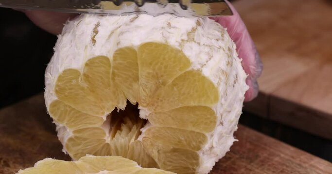 peeled pomelo on the table, cooking with ripe yellow pomelo