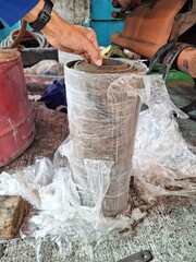 Jakarta, Indonesia, 15 July 2023; The process of making packing gaskets on 20kv bushings and transformer manholes