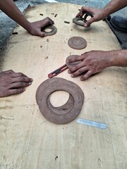 Jakarta, Indonesia, 15 July 2023; The process of making packing gaskets on 20kv bushings and transformer manholes