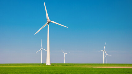 Windmill park with clouds and a blue sky, windmill park in the ocean aerial view with wind turbine Flevoland Netherlands Ijsselmeer. Green Energy production in the Netherlands