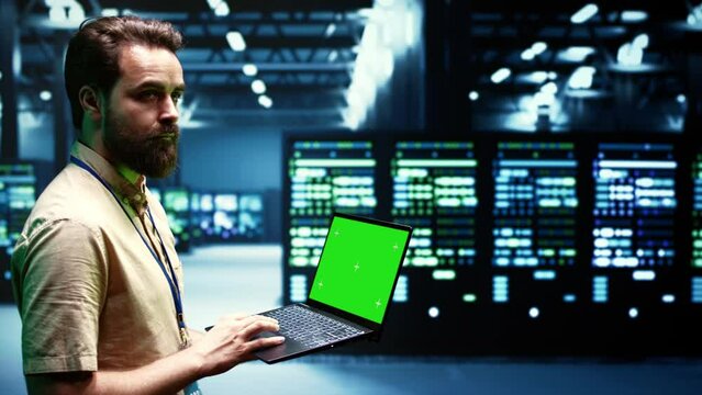 Expert using chroma key laptop to check server hub configuration settings, close up. Mechanic checking event logs in monitoring software to find broken data center components root cause