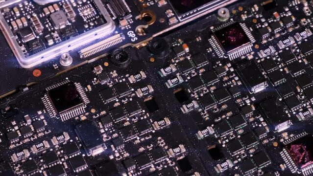 Close-up metal surface digital microcircuit technological background, slow tracking shot, computer components macro close up. PC chip, cpu, circuits.