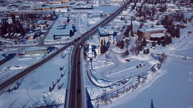 4K Drone Video of Immaculate Conception Catholic Parish on the Banks of the Frozen Chena River in Downtown Fairbanks Alaska on Snowy Winter Day