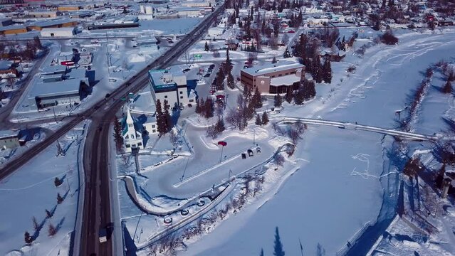 4K Drone Video of The William Ransom Wood Centennial Bridge over Frozen Chena River in Downtown Fairbanks Alaska on Snowy Winter Day