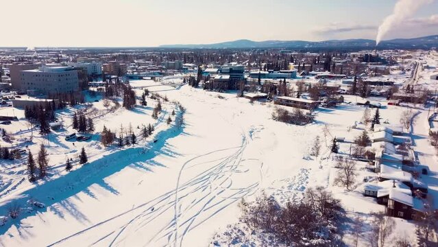 4K Drone Video of Frozen Chena River in Downtown Fairbanks Alaska on Snowy Winter Day