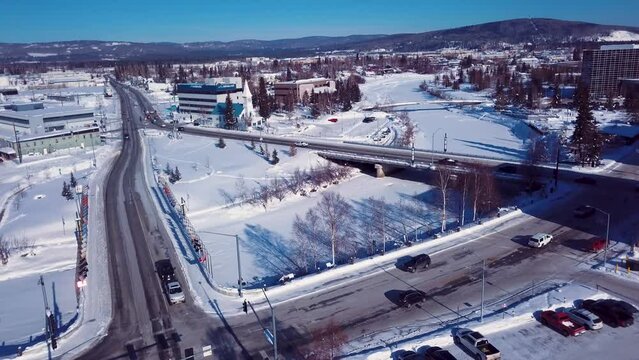 4K Drone Video of Barnette Street and Cushman Street Bridges over Frozen Chena River in Downtown Fairbanks Alaska on Snowy Winter Day