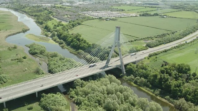 Traffic On M1 Motorway In Mary McAleese Boyne Valley Bridge In Ireland. - aerial