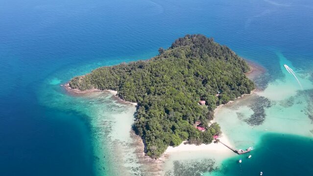 Aerial Overhead View Of Sapi Island On Clear Sunny Day. Circle Dolly Shot
