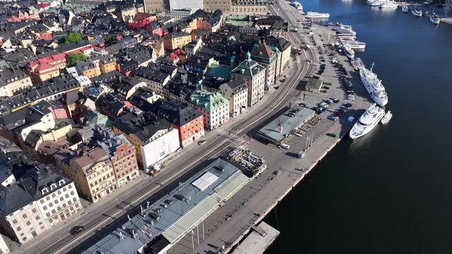 Gamla Stan, reveal from notable street on waterfront. Beautiful Stockholm aerial cityscape.