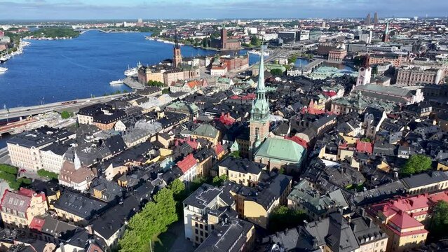 Amazing drone flyover church in Gamla Stan, Stockholm. Sweden capital cityscape with historic landmarks.
