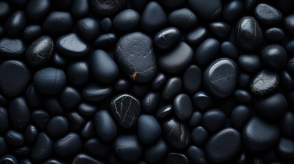 close-up glossy black wet pebbles. Macro, pebble background. 
