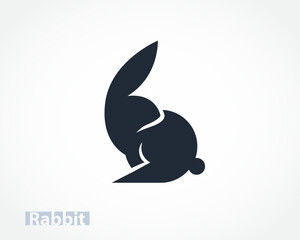 Fototapeta premium very simple abstract cartoon easter bunny rabbit looking back logo design template illustration