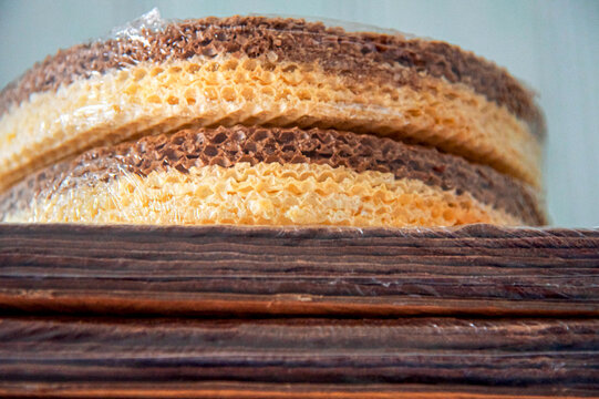 A stack of thin wafers for cakes, and cakes for spartak