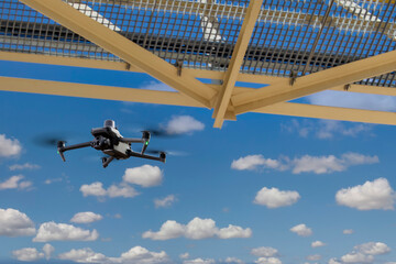 enterprise drone with RTK module under a bridge doing an inspection, exploring gas pipelines