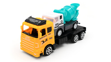 Toy truck with trailer transports cement mixer on white background.