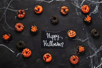 Halloween donuts on a dark background.