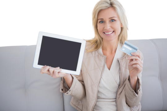 Digital png photo of caucasian woman holding credit card and tablet on transparent background
