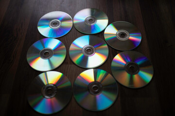 cd plates splitting light, diffraction. group of plates on the floor.
