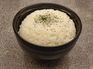 cooked rice in black bowl