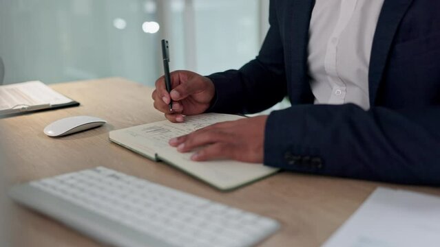 Business hands, notebook writing and planning for financial ideas, stock market strategy and budget goals at desk. Professional worker or trader with trading notes, brainstorming or tips in journal