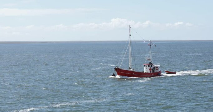 Cutter with dinghy, Buesum, Schleswig-Holstein, Germany, Europe