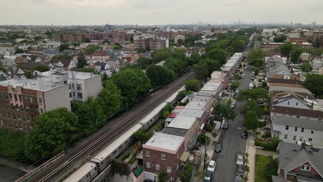 A view of the neighborhood from the top of the building. Brooklyn. subway train moving to next station