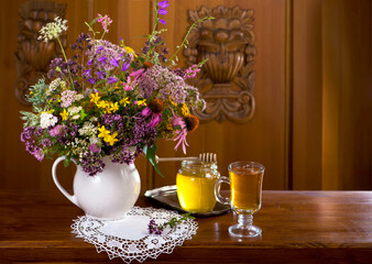 Still life from medicinal herbs, honey, herbal tea
