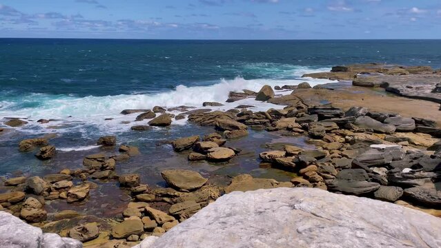 4k Video -Breathtaking coastal, cliff and ocean views on the scenic Cape Baily Track at Kurnell in Kamay National Park, South Sydney, Australia. Zooming in close up to the waves crashing on the rocky 