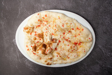 Special tandoori kashmiri Nan, naan, bread, roti and nun served in dish isolated on background top view of bangladesh food